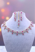 golden with redish pink stones